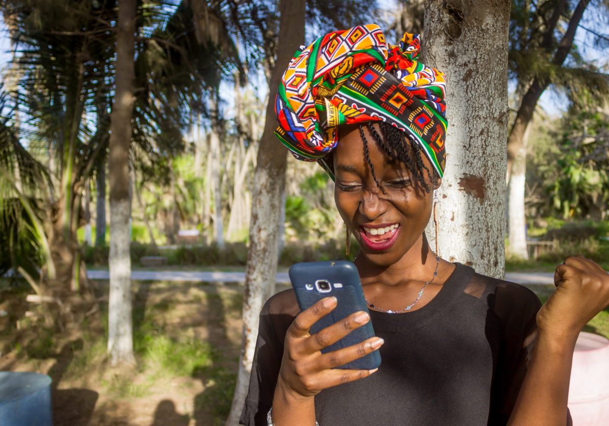 Photo of woman on her phone in Senegal