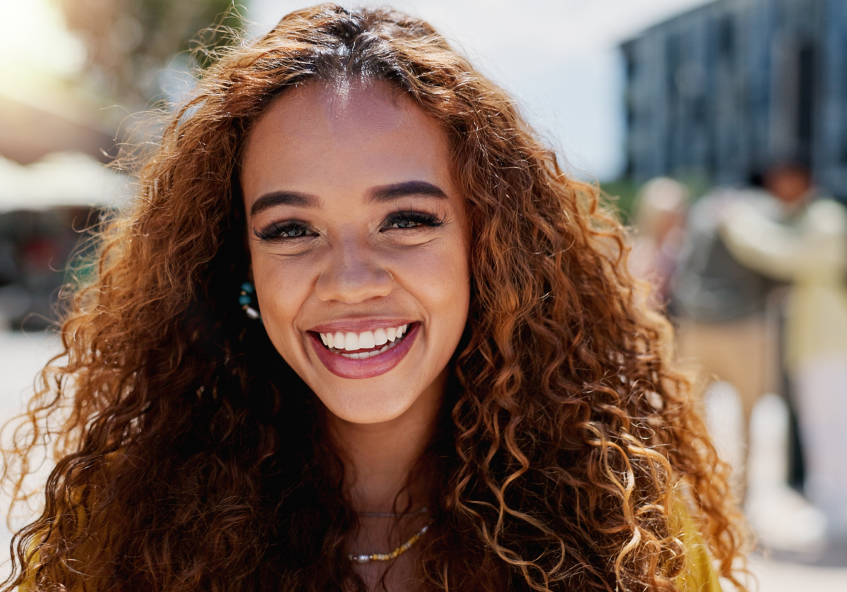 Woman smiling in a city in Puerto Rico